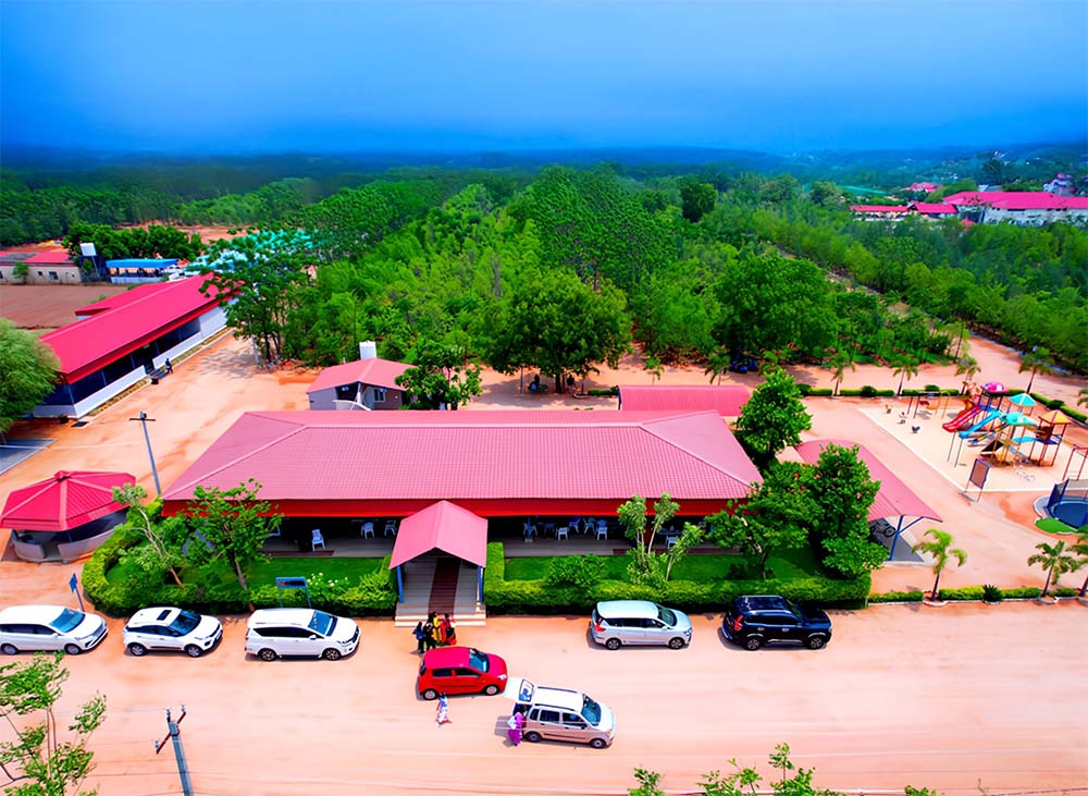 Aerial view of Go Ranch Resort's event venue surrounded by lush greenery,ideal for corporate events and team meetings near Hyderabad