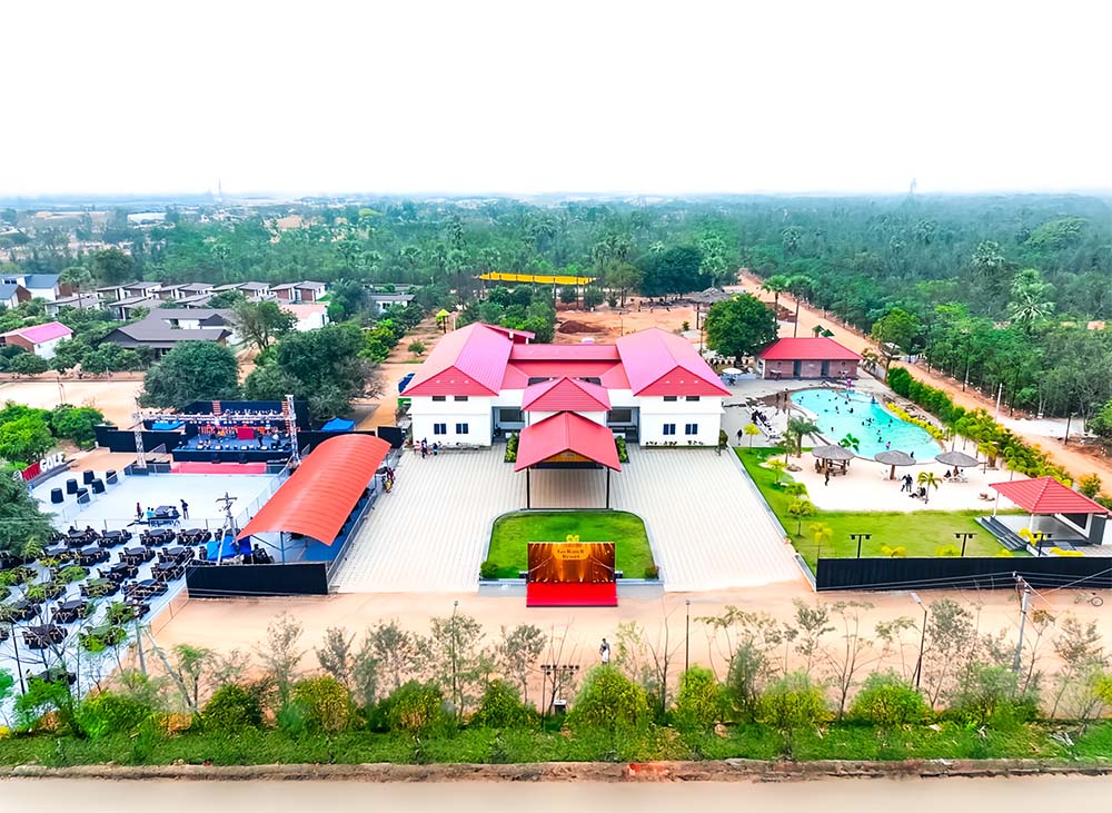 Aerial view of Go Ranch Resort clubhouse with poolside area, ideal for weddings, celebrations, and special events near Hyderabad