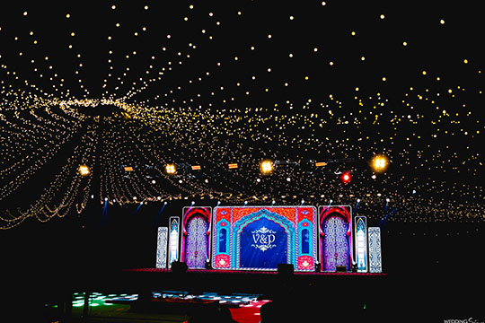 Dream wedding venue at Go Ranch Resort with grand stage decor and magical night lighting – perfect for destination weddings near Hyderabad