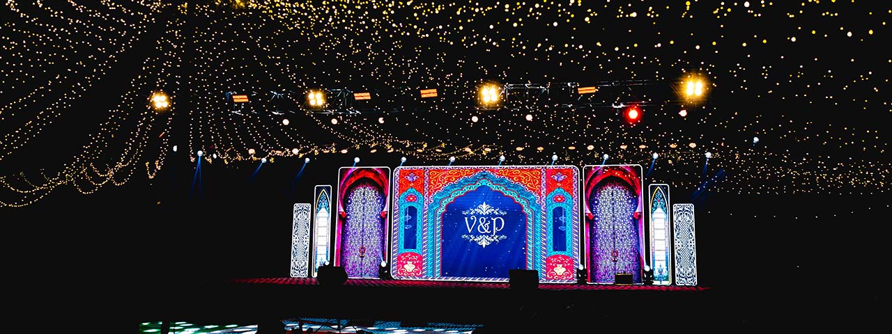 Dream wedding venue at Go Ranch Resort with grand stage decor and magical night lighting – perfect for destination weddings near Hyderabad