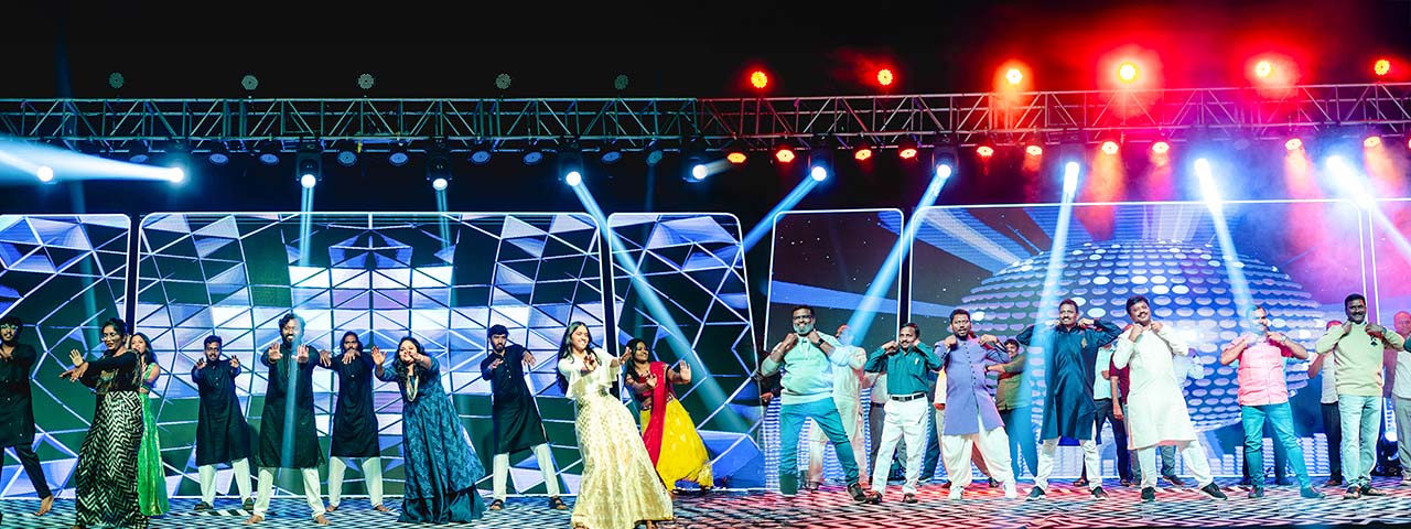 Sangeet ceremony at Go Ranch Resort with vibrant dance performances and dynamic stage lighting – perfect wedding event venue near Hyderabad