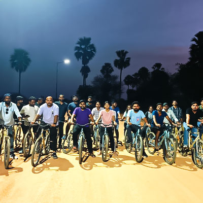 Employees enjoying cycling activity during corporate outing at Go Ranch Resort